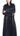 Close-up of transparent white buttons and cuffs on black silk abaya
